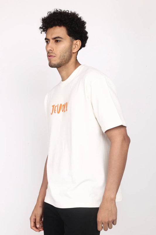 Jevoxx Signature Tee – Off-White with Orange Hit
